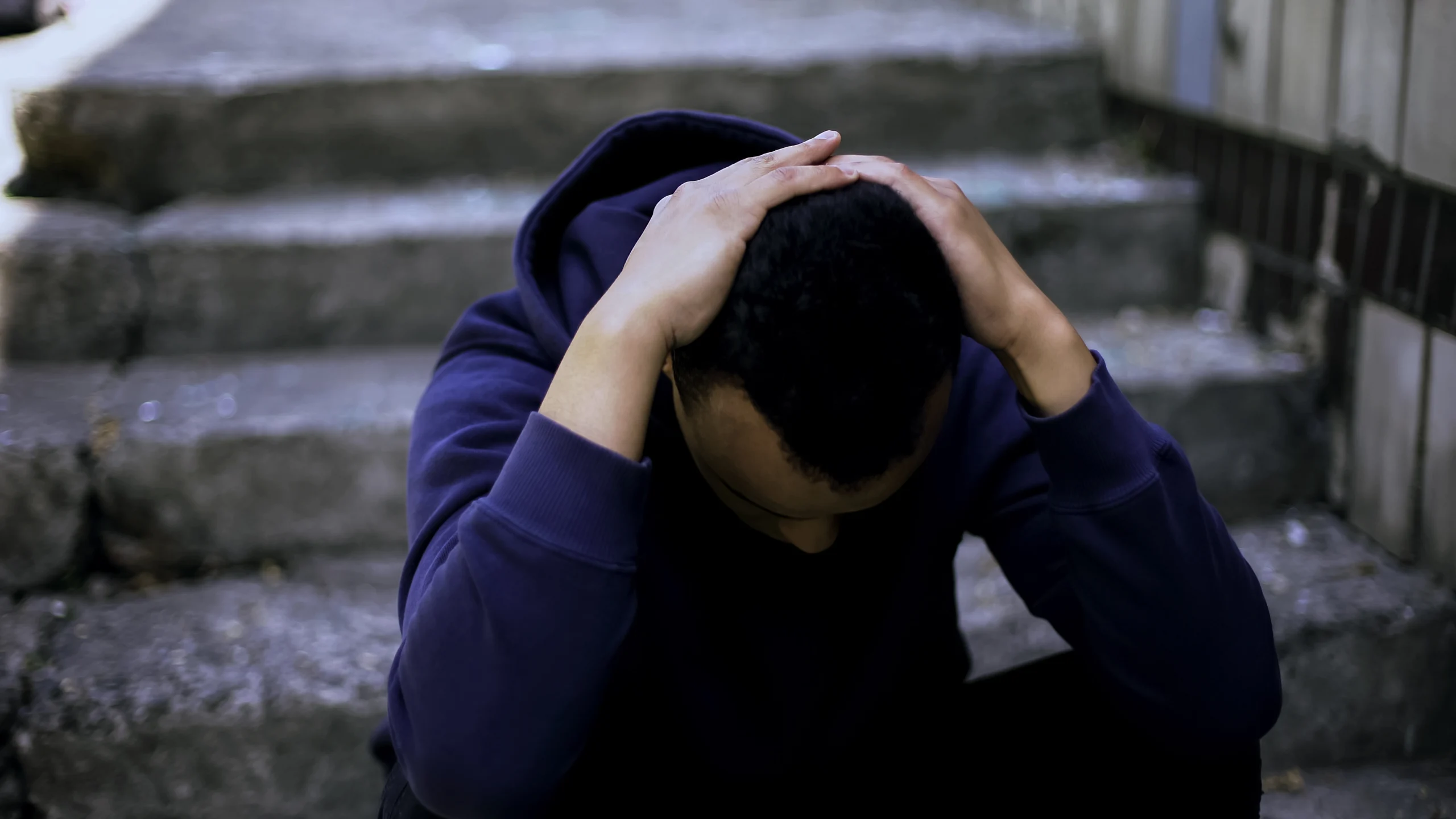 a man with hands on his head