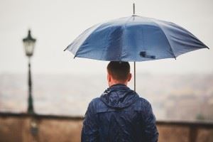 Man walking with an umbrella in the rain