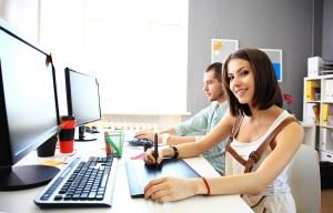 Young female sitting at a computer working