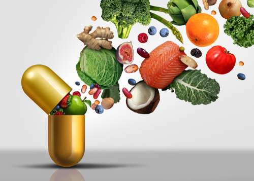 Clean eating food bursting out of a pill/vitamin