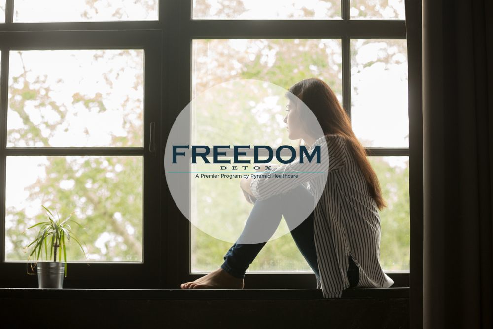 Freedom Detox a woman looking out the window