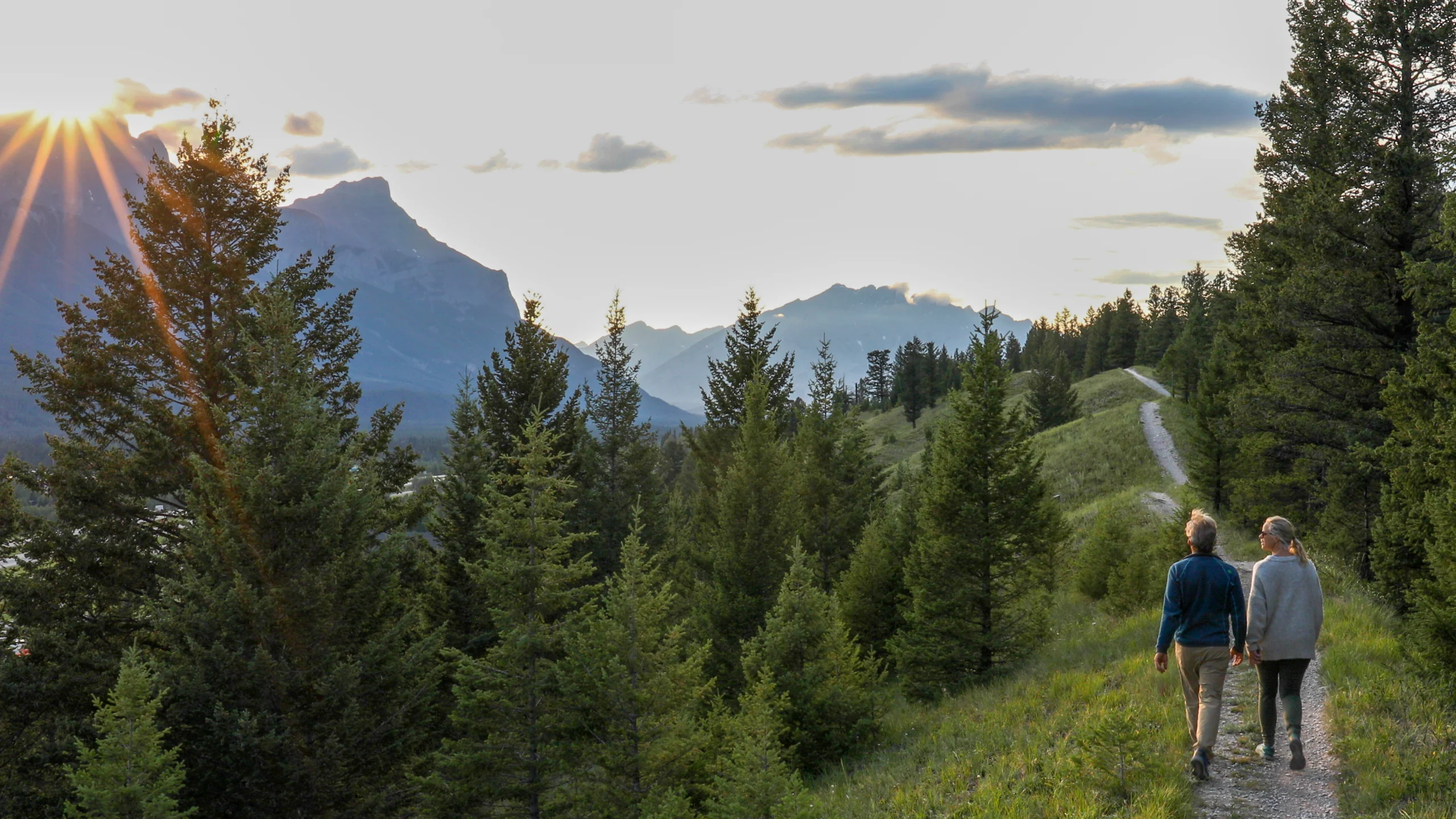 People staring at mountains in the distance caring for their mental health