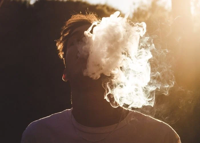 man vaping outside