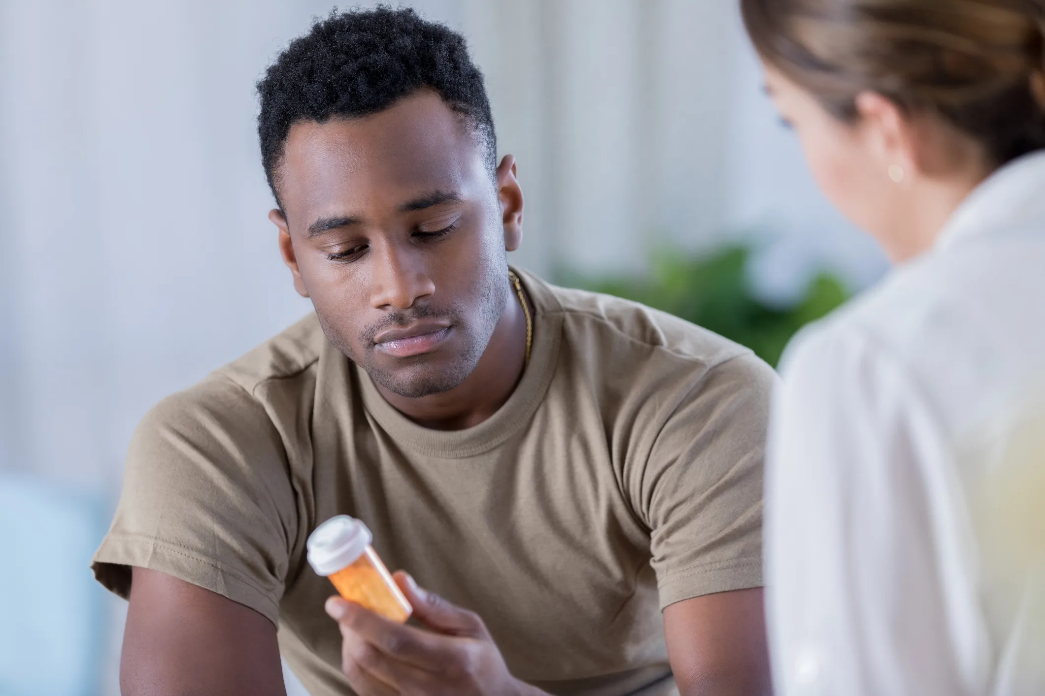 Man struggling with alcohol addiction considering medication for recovery treatment