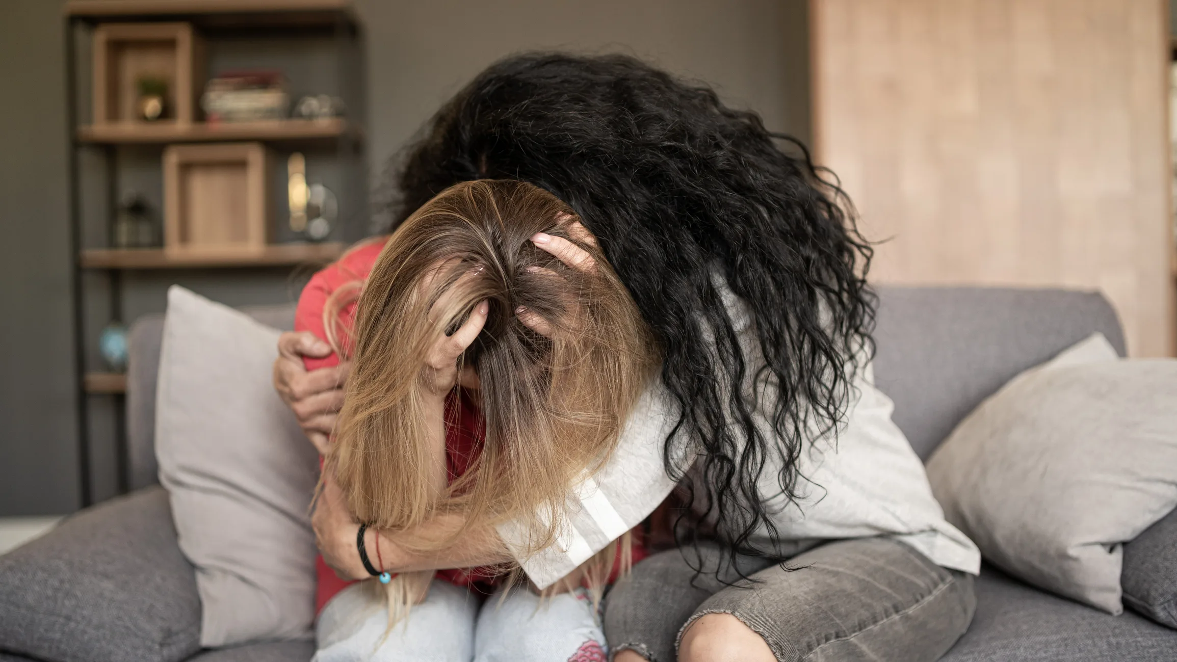 Women supporting sad friend trying to solve a problem.