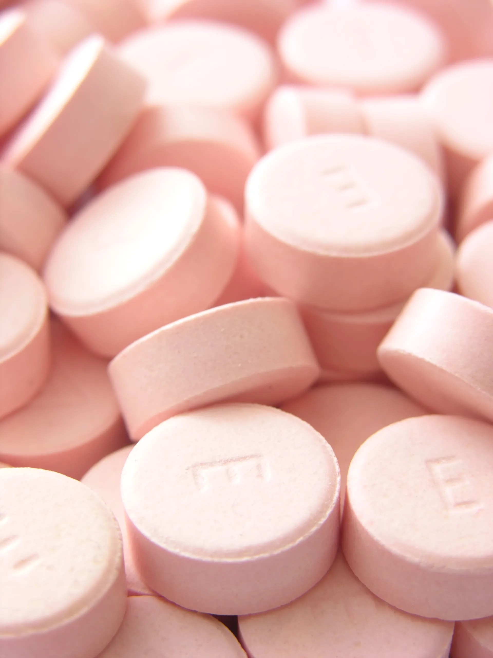 Group of Tesla E pills. Shallow depth of field. Focus on front letter E