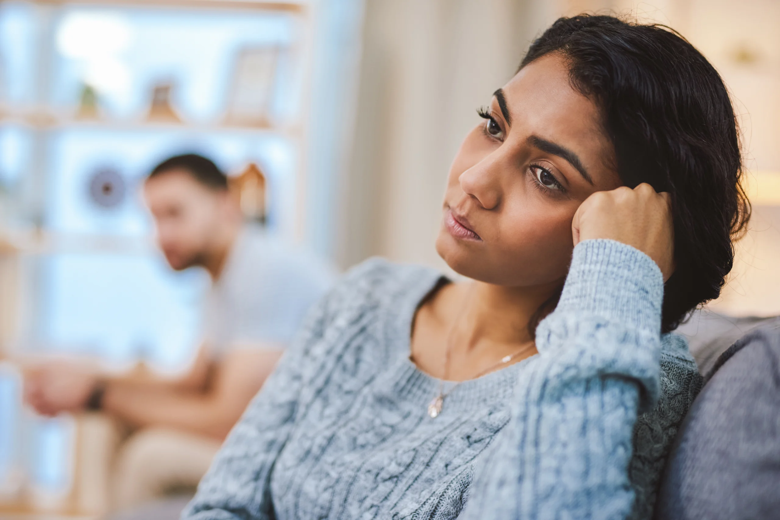 Cropped shot of a young couple giving each other the silent treatment during a fight at home